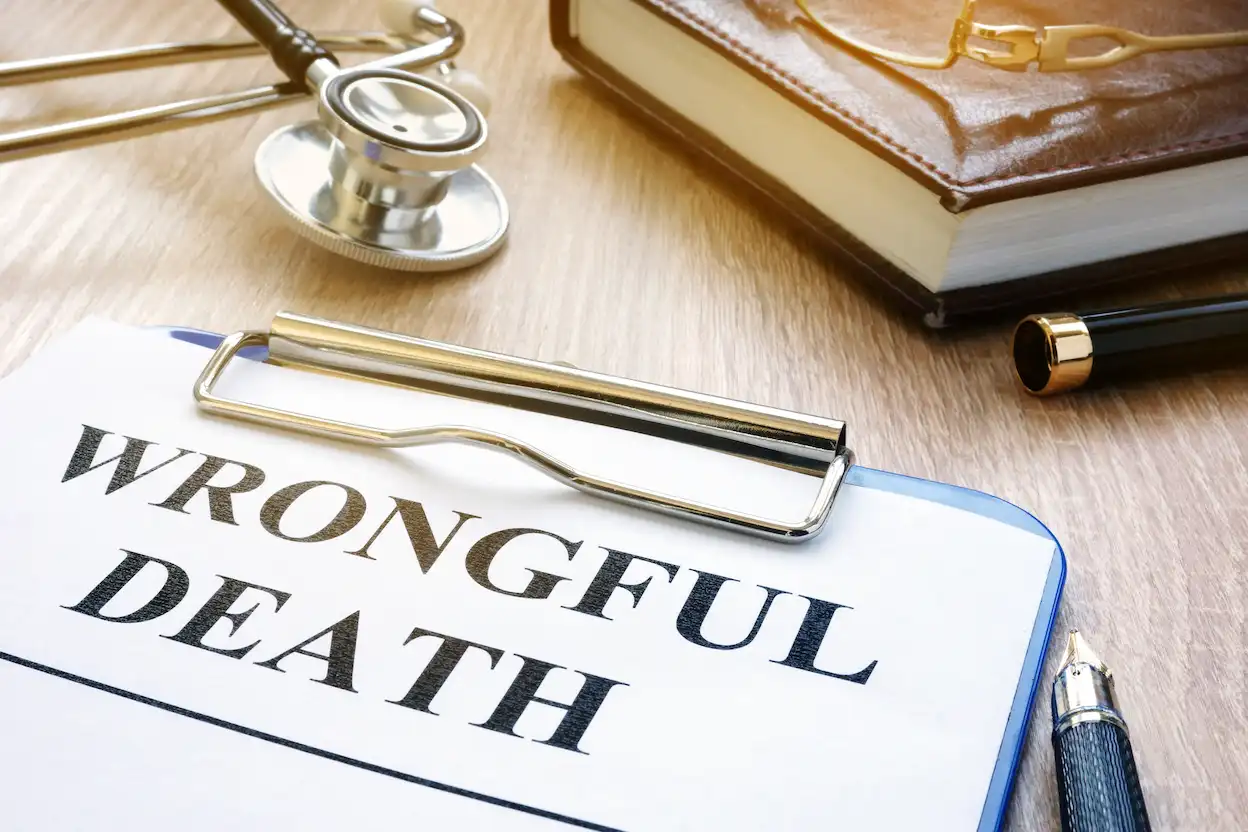 Picture of a contract and stethoscope depicting wrongful death case won by Van Camp Law Firm in North Carolina