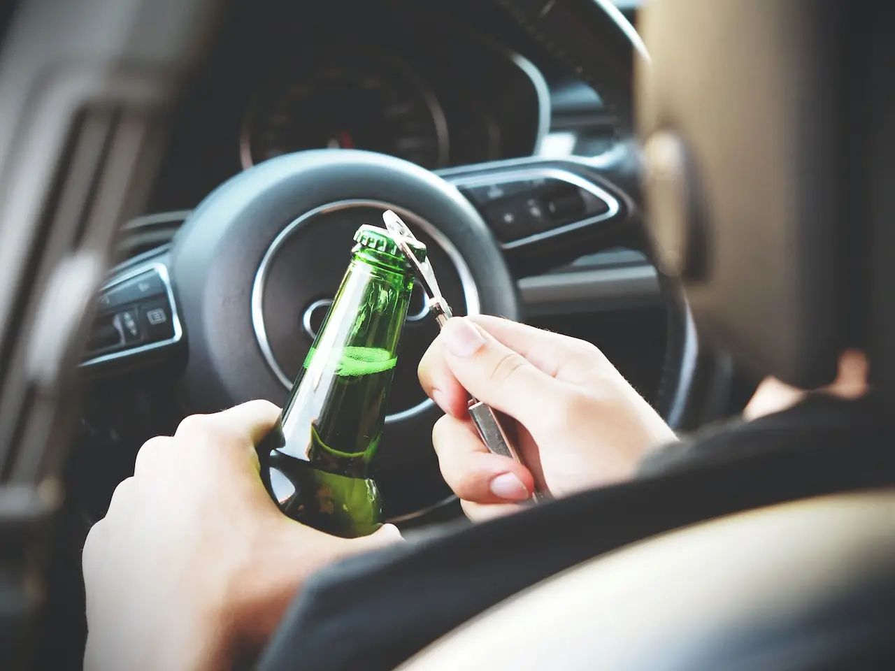 A person posing for a drinking and driving picture for the blog about arrested for a DUI.
